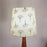 Bevel Wooden Floor Lamp with Brown Base and Yellow Printed Fabric Lampshade